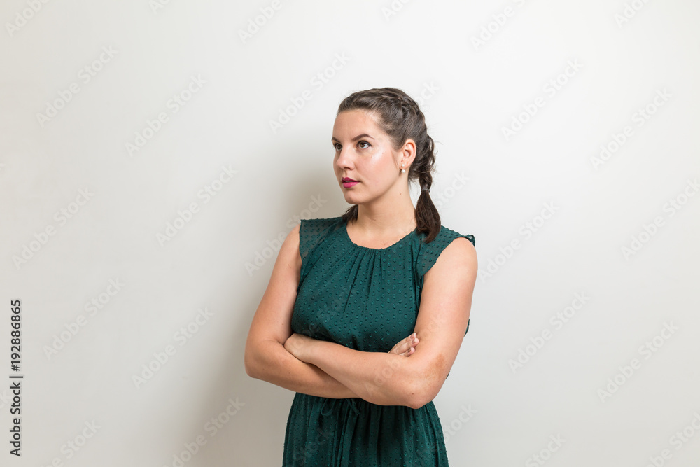 Business woman stands with arms crossed Business woman stands with arms crossed