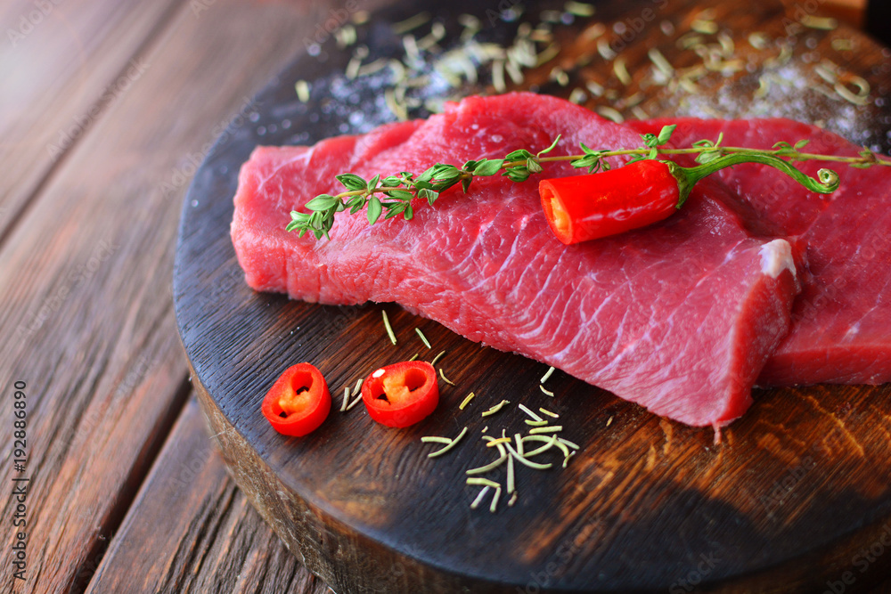 Macro of a steak meat beef on a rural wooden desk. Macro of a steak meat beef on a rural wooden desk.