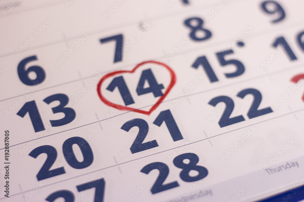 14th February marked with a heart on calendar and wooden pins with red hearts. Close up. St.Valentine's concept. 14th February marked with a heart on calendar and wooden pins with red hearts. Close up. St.Valentine's concept.