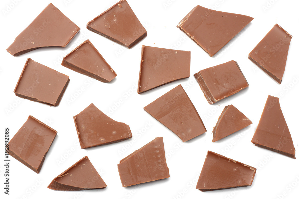 cracked chocolate candies sweets isolated on white background top view
