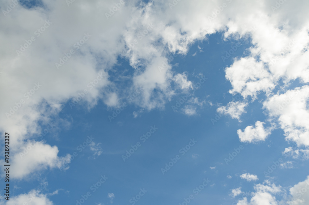 Obraz premium The light blue sky with white clouds for background or texture. Copy space