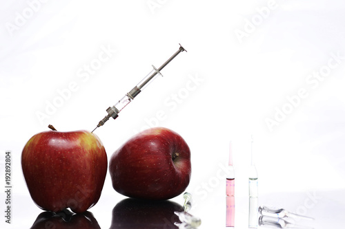 Genetically modified foods, apple pumped with chemicals