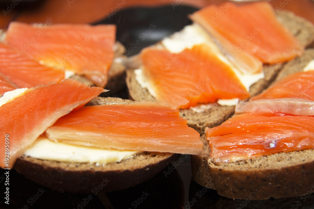 Fresh salmon sandwich with salted salmon and butter and dark bread Fresh salmon sandwich with salted salmon and butter and dark bread