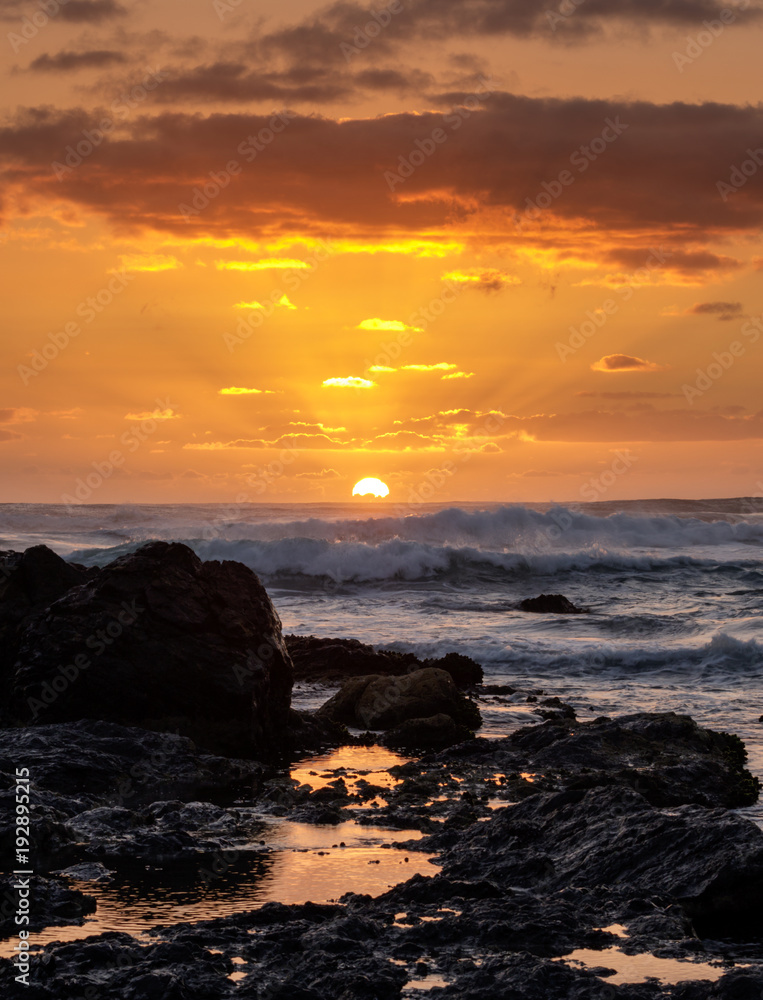 Sunrise over the ocean - path of gold