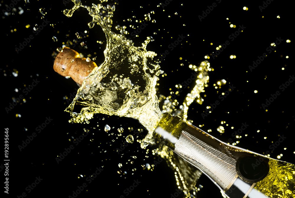 Champagne cork explosion, opening bottle for a new year party. Stock Photo  by photocreo