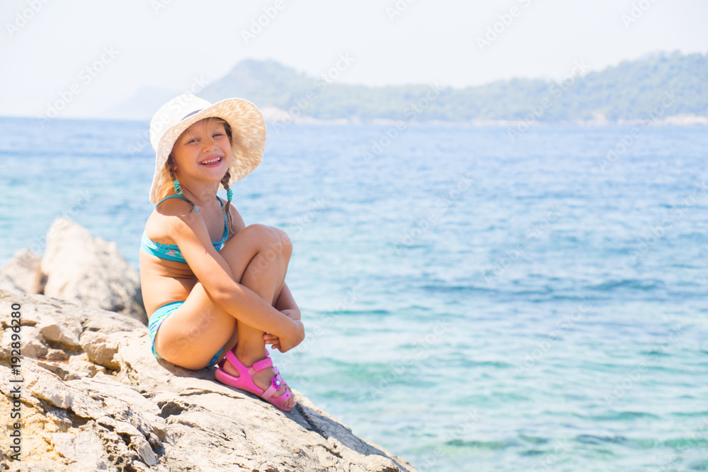 little girl on sea coast