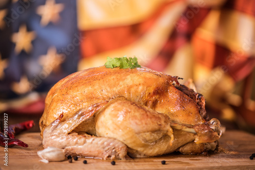 close up of fresh roast chicken against american flag background