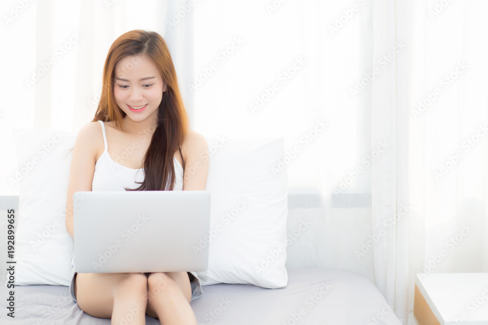Beautiful young asian woman using laptop for leisure on bedroom, girl working online with notebook freelance, business concept. Beautiful young asian woman using laptop for leisure on bedroom, girl working online with notebook freelance, business concept.