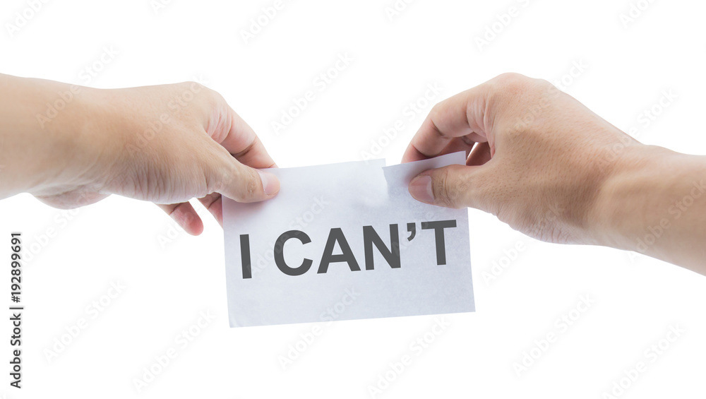 Hands tear a paper with text 