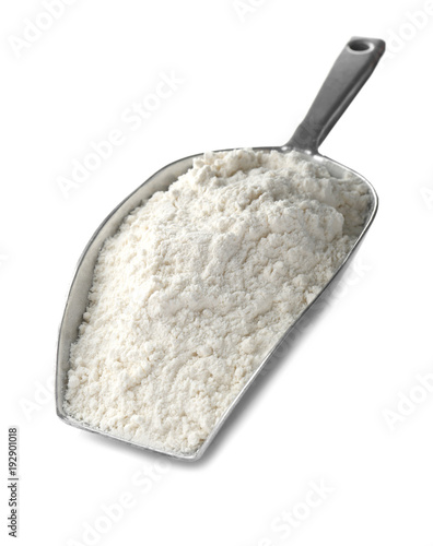 Scoop with wheat flour on white background