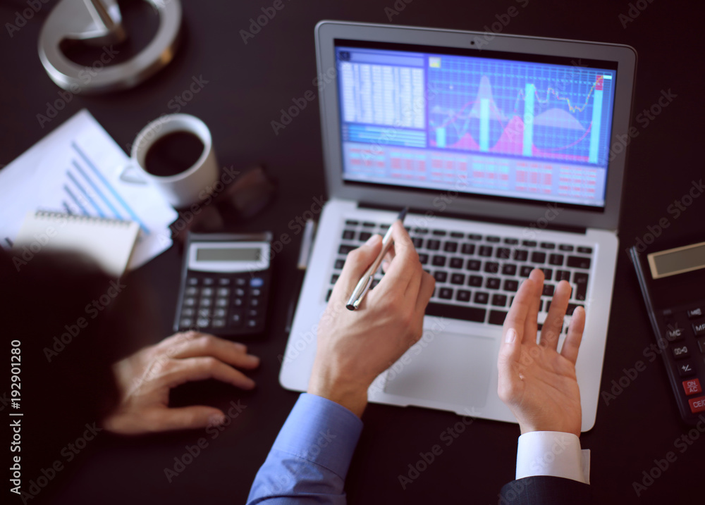 Men working at table in office, closeup. Financial trading concept Men working at table in office, closeup. Financial trading concept