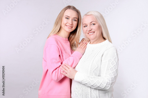 Young daughter and mother o...