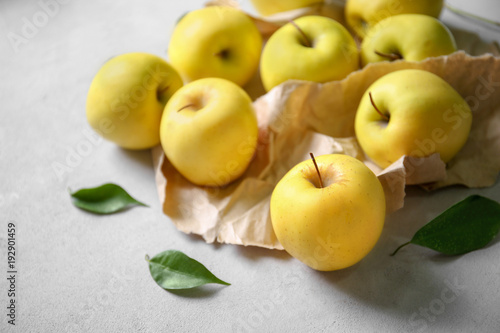 Ripe yellow apples on light background