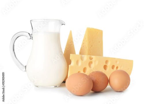 Dairy products and eggs on white background