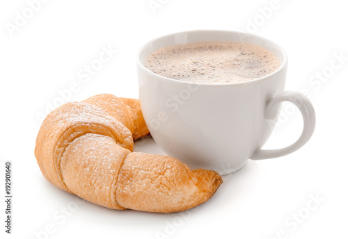Fototapeta Naklejka Na Ścianę i Meble -  Tasty crescent roll with cup of coffee on white background