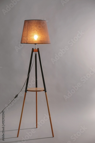 Elegant floor lamp on grey background