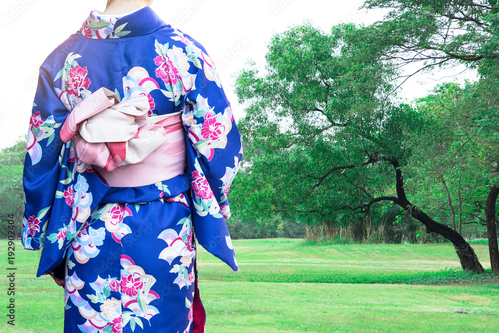 Woman wearing Kimono traditional Japan walking at public park. Woman wearing Kimono traditional Japan walking at public park.