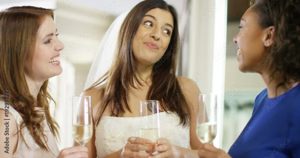 4K Happy young woman drinking champagne with her friends at a bridal gown fitting. Slow motion. 4K Happy young woman drinking champagne with her friends at a bridal gown fitting. Slow motion.