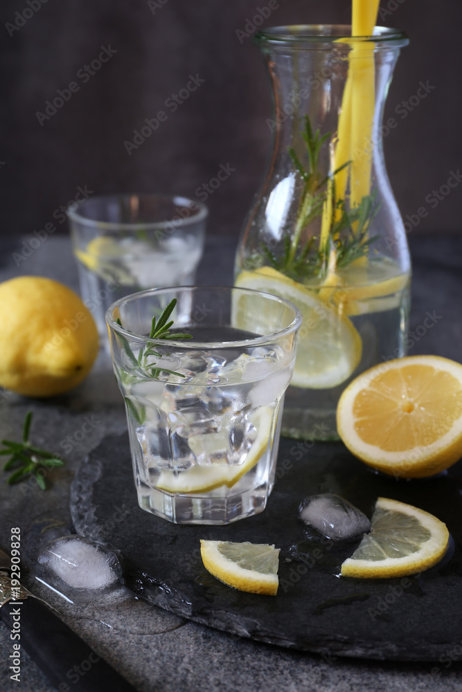 Detox water, fresh lemonade with ice, lemon and rosemary Detox water, fresh lemonade with ice, lemon and rosemary