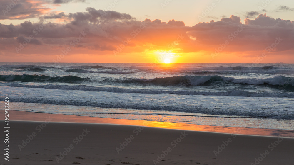 Vibrant beach sunrise