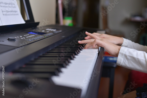 kid hands playing piano