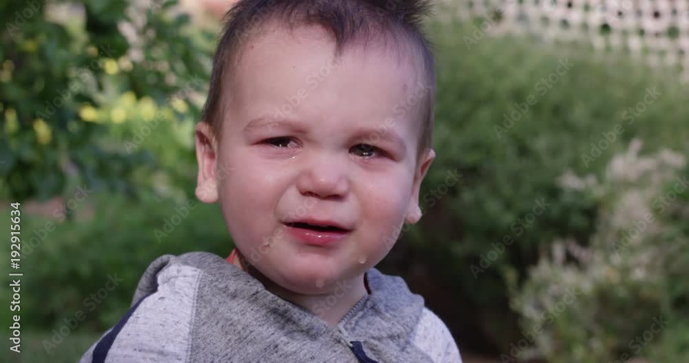 Crying boy in park - slow motion Crying boy in park - slow motion