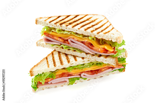 Sandwich with ham, cheese, tomatoes, lettuce, and toasted bread. Above view isolated on white background.