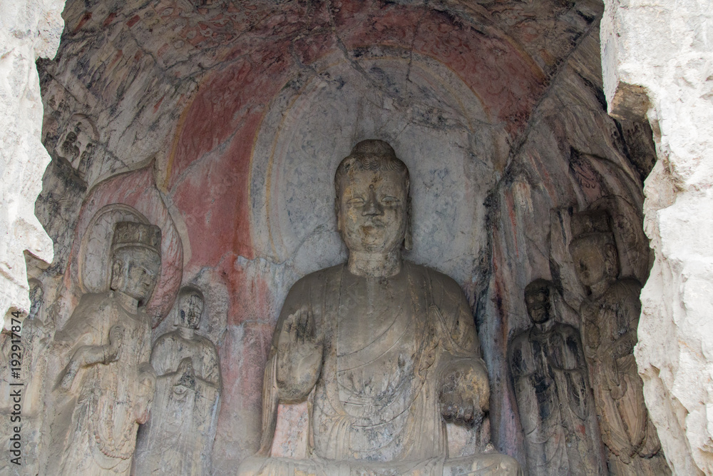 Close-up Stone Buddha Statue Carved from the mountains Close-up Stone Buddha Statue Carved from the mountains