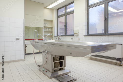 Autopsy tables in morgue photo