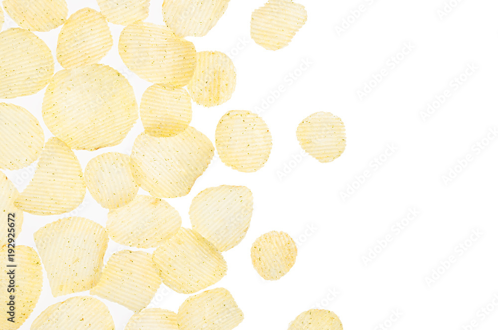 Yellow potato chips fly as decorative border on white background, isolated, top view. Yellow potato chips fly as decorative border on white background, isolated, top view.