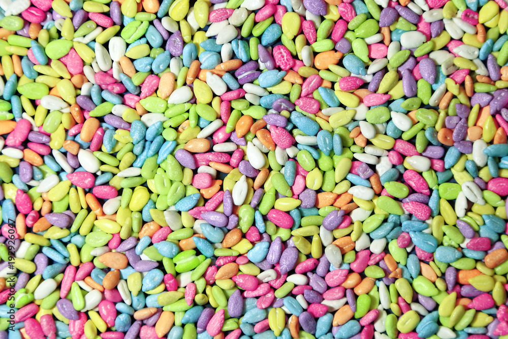 Abstract bright multicolored rectangular background of small objects with texture of seeds in the glaze. Abstract bright multicolored rectangular background of small objects with texture of seeds in the glaze.