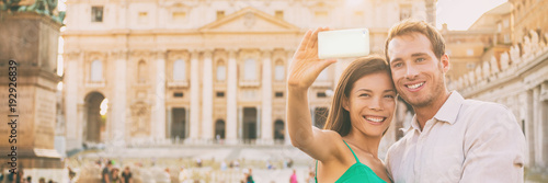 Rome tourists on honeymoon vacation taking selfie photo with phone in front of Vatican, banner panorama horizontal crop. Couple in love on summer holiday, europe travel.