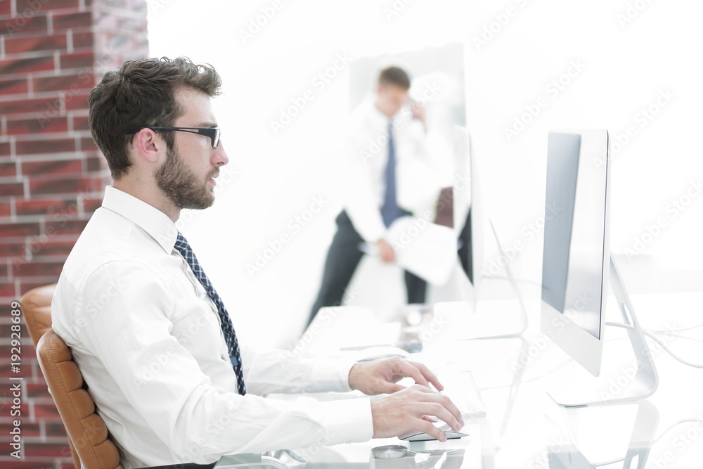 Fototapeta premium businessman working on computer with financial charts