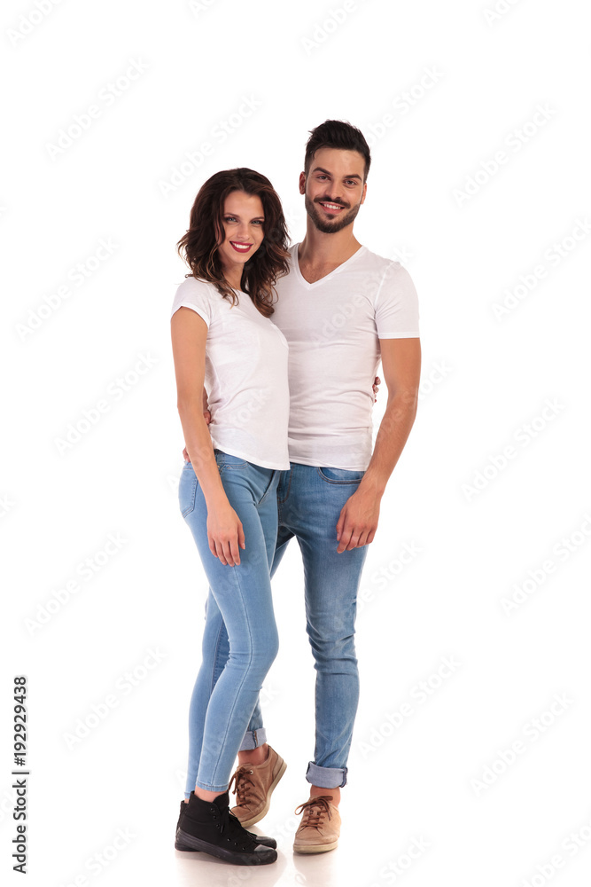 full body picture of a young embraced couple