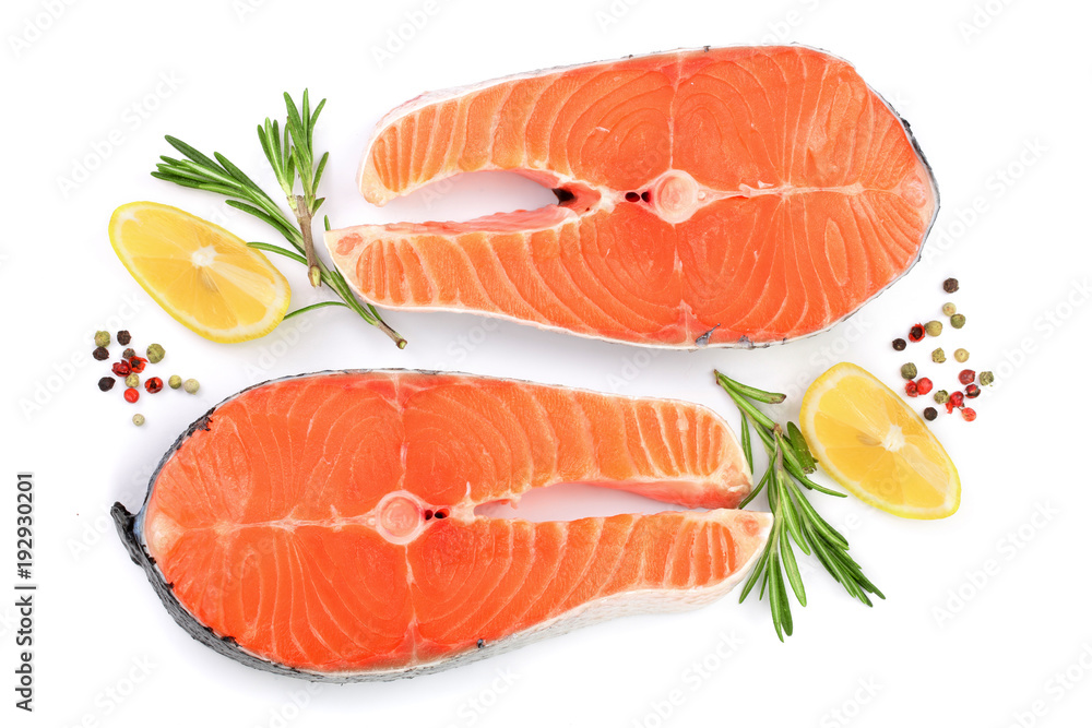 Slice of red fish salmon with lemon, rosemary and peppercorns isolated on white background. Top view. Flat lay Slice of red fish salmon with lemon, rosemary and peppercorns isolated on white background. Top view. Flat lay