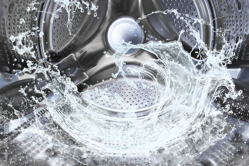 Fotografia Water splash of the washing machine drum.