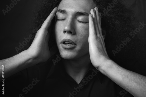 A handsome man is posing in studio. Black and white © Dima Aslanian