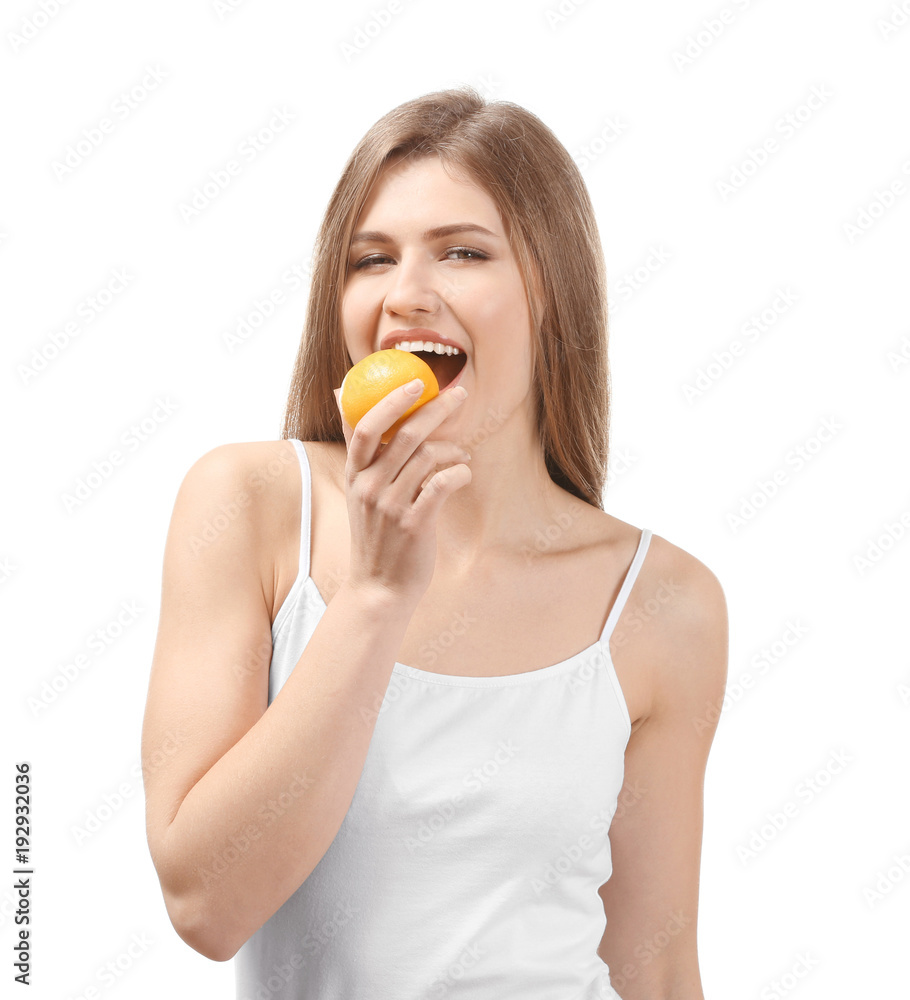 Beautiful young woman with ripe lemon on white background Beautiful young woman with ripe lemon on white background