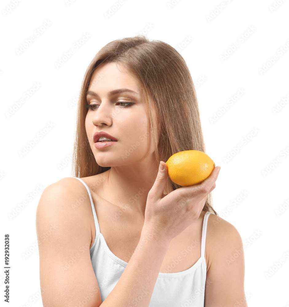 Beautiful young woman with ripe lemon on white background Beautiful young woman with ripe lemon on white background