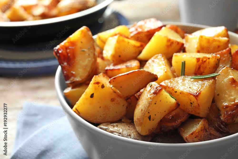 Tasty potato wedges in bowl, closeup Tasty potato wedges in bowl, closeup