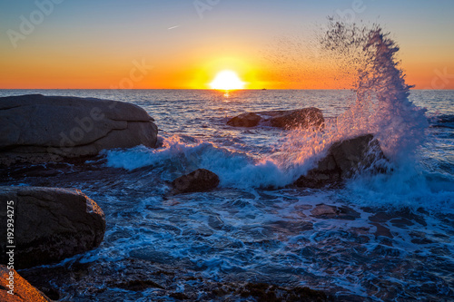 Beautiful sunrise in a bay with rocks in Costa Brava, Spain