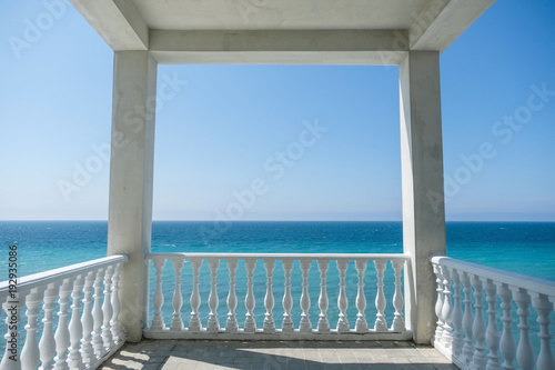 White gazebo on the waterfront with seascape view. Close up view