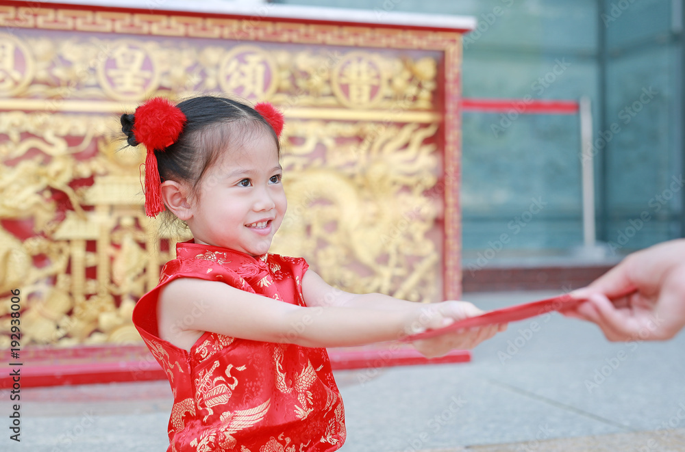 Happy little Asian girl received a red envelope. Chinese New Year celebration. Happy little Asian girl received a red envelope. Chinese New Year celebration.