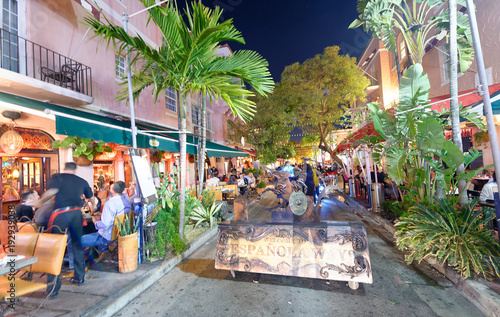 MIAMI - FEBRUARY 25, 2016: Tourists along Espanola Way on a beautiful winter night. Miami Beach is a famous tourist attraction © jovannig