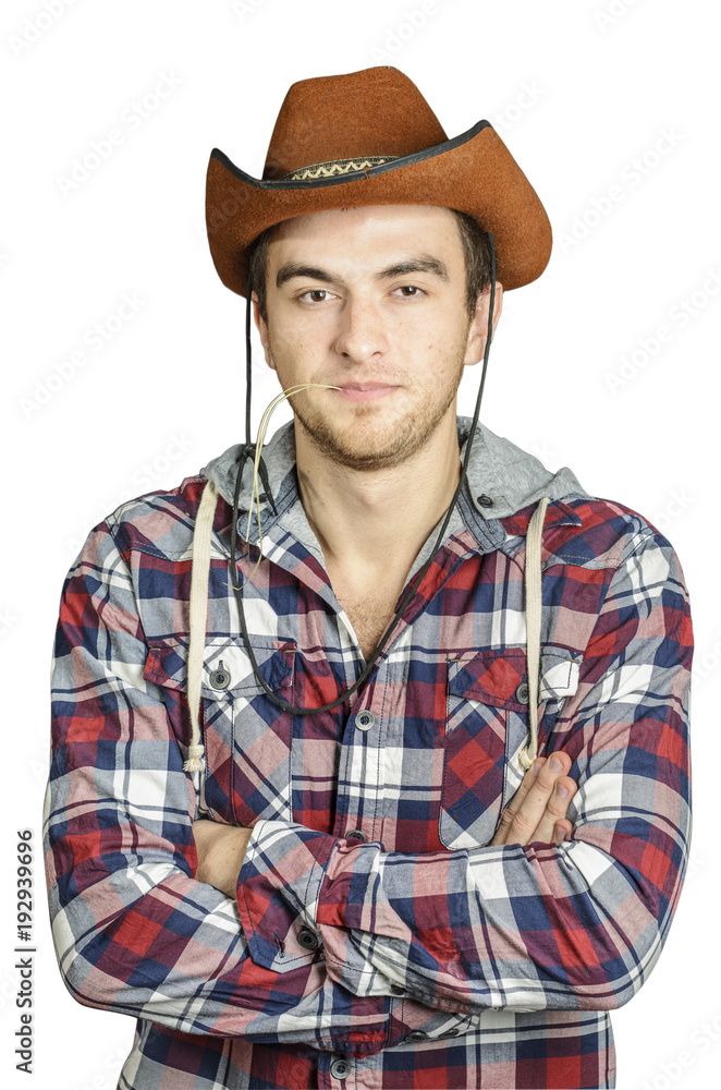 Portrait of a Cowboy. dark hair, jeans , plaid shirt. Portrait of a Cowboy. dark hair, jeans , plaid shirt.