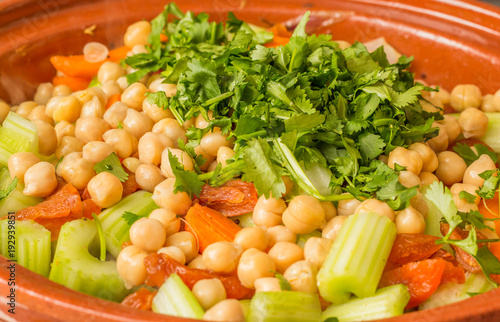 Fresh vegetables and cilantro in a tagine