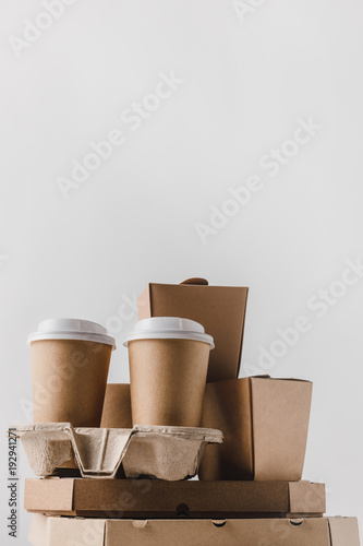 pizza boxes and disposable coffee cups isolated on white