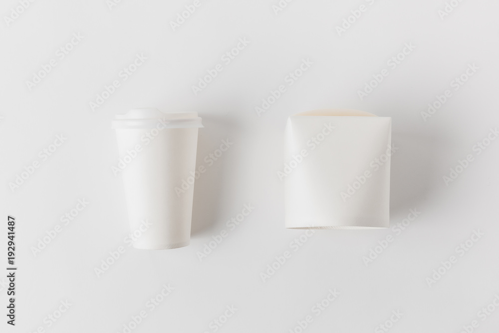 top view of coffee in paper cup and noodles box on white surface top view of coffee in paper cup and noodles box on white surface