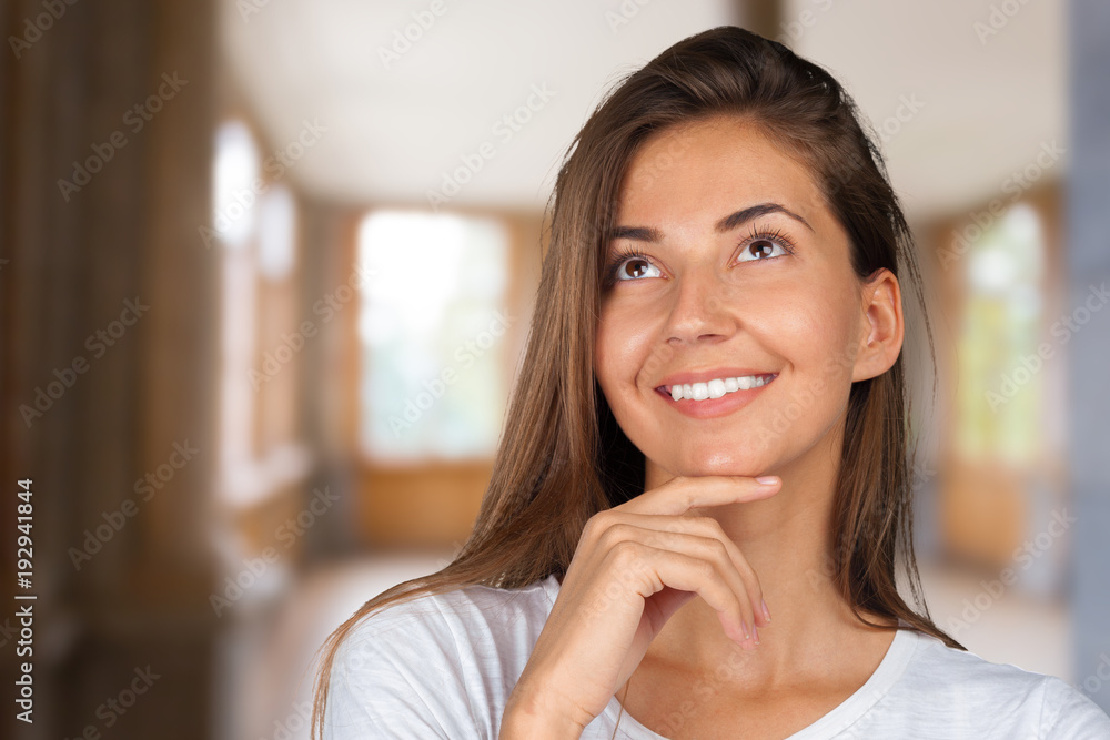Portrait of a beautiful expressive young brunette with idea Portrait of a beautiful expressive young brunette with idea