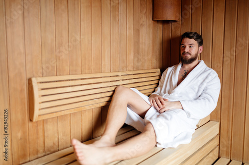 Healthy male in sauna relaxing